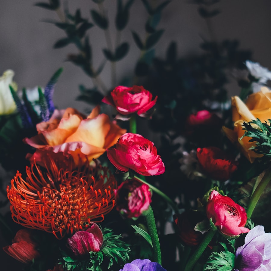 Rich arrangement of ranunculus and anemones in autumn tones